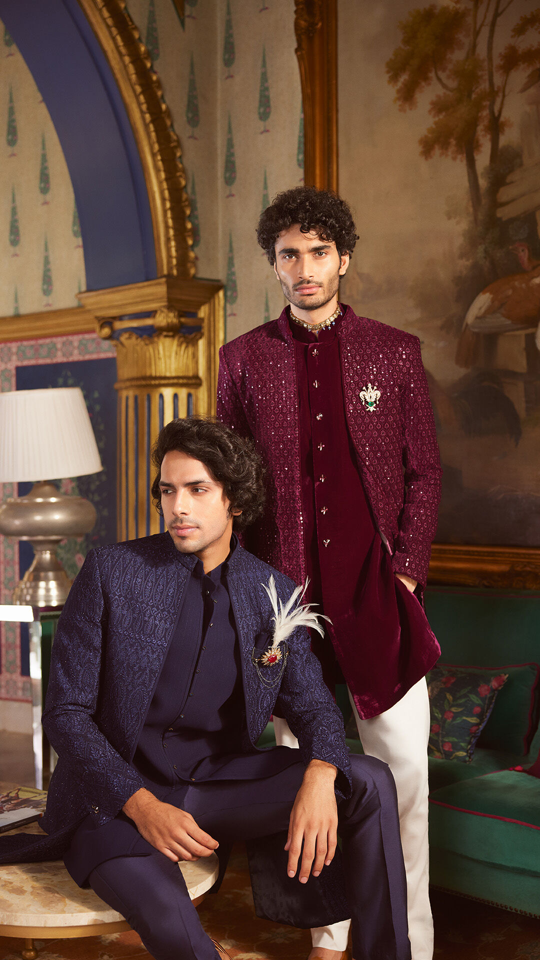  Man in Indo-Western sherwani featuring gold brooch with decorative feather